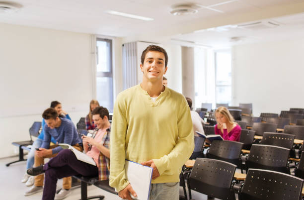 istock group of smiling students in lecture hall 1307946565