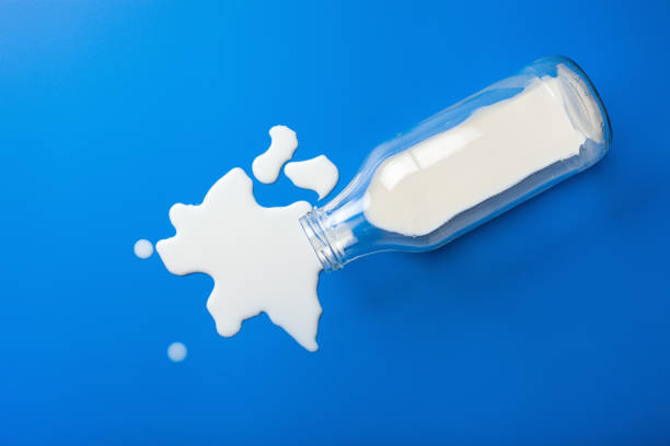 istock bad milk lactose intolerance allergy. milk bottle splatter. avoid dangerous dairy 1307946867