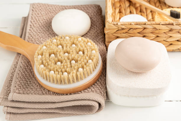 istock Spa, beauty cosmetics and body care treatment concept. Creative composition with bath accessories - massaging brush, soap bars and sponges on white background. 1307949130