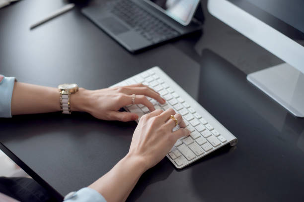 istock Close up. woman typing on laptop computer keyboard in office. 1307949636