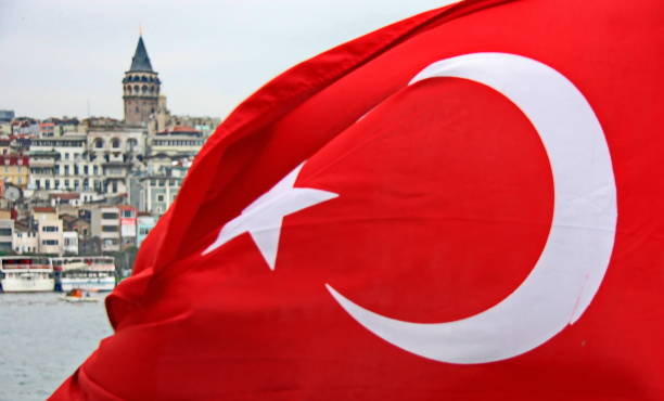 istock Turkish flag with Galata tower at the back, Istanbul, Turkey.. 1307950476