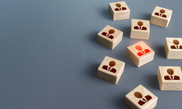 istock Red highlighted man among randomly lying blocks with people. Copy space. Recruiting, staffing. Human resources. Hiring best talented professional candidate for a vacant job position. Employment Agency 1307950821