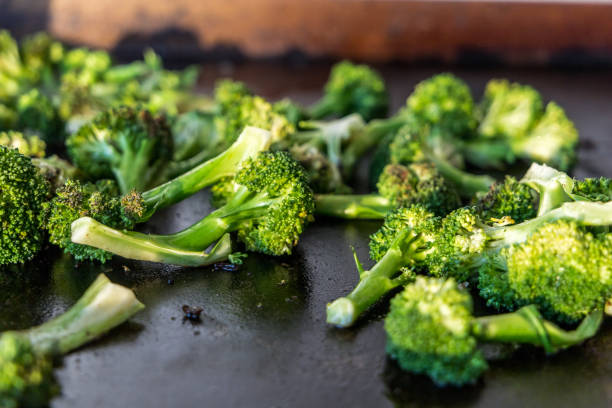 istock Grilled broccoli on a flat outdoor griddle 1307951836