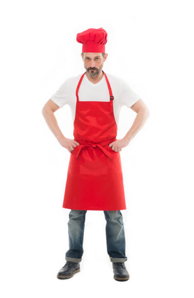 istock Man in apron. Confident mature handsome man white background. Cooking as professional occupation. Uniform for cooking. Chef in restaurant. Cooking is my hobby. Learn cooking. Welcome to my kitchen 1307953293