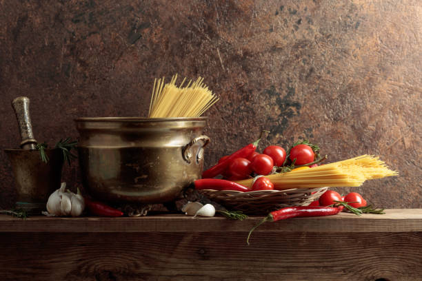 istock Pasta with ingredients on a old wooden table. 1307953420