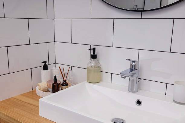 istock Body and face care essentials in the white bathroom. 1307954650