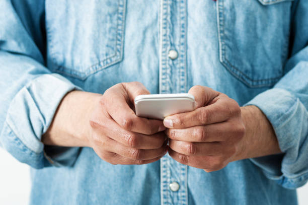 istock businessman using smartphone at his home office 1307957693