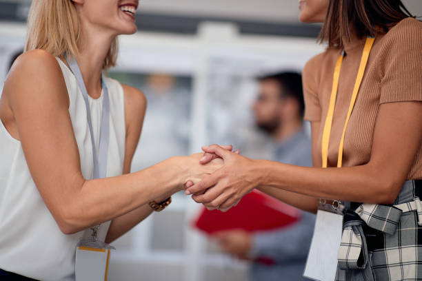istock contracted work - handshake business woman 1307958984