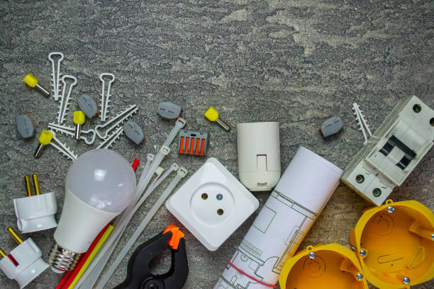 istock Electrical tools and a set of components for use in electrical installations on a gray background with a place for text 1307960221