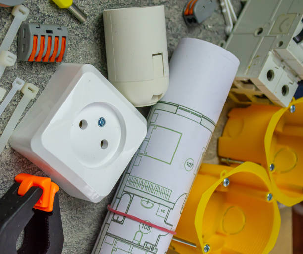 istock Electrical tools and a set of components for use in electrical installations on a gray background with a place for text 1307960223