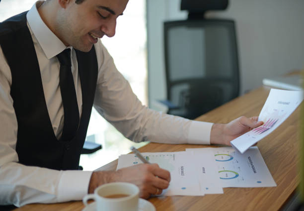 istock Businessman sitting analyze document information in the workplace 1307960306