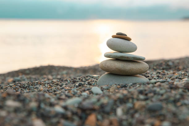 istock Pyramid of pebbles on the beach 1307960321