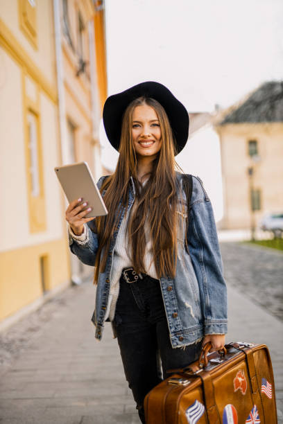 istock Beautiful female traveler  looking on digital tablet navigation system 1307960641