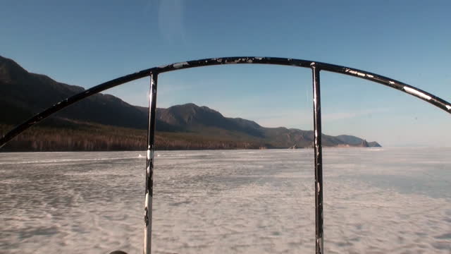 Airboat air glider moves on ice of Lake Baikal.