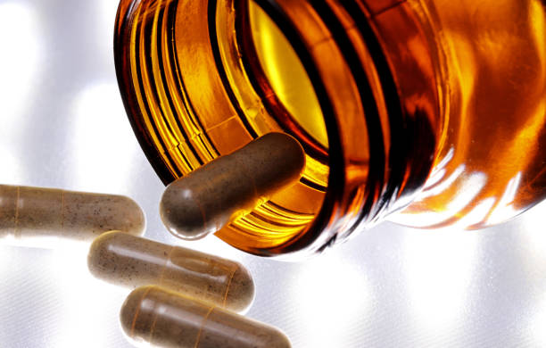 istock pills in a glass bottle 1307964159