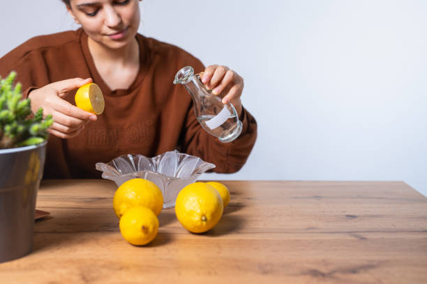 istock Caucasian brunette, responsible, clever girl doing cleaning solution at home from apple vinegar, baking soda, fresh lemon. Zero waste sustainable lifestyle. Environment, friendly home. Home cleaning 1307967879