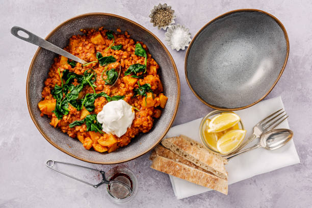 istock Red Lentil and Potato Stew with Wilted Spinach and Greek Yoghurt 1307967897