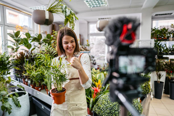 istock Female florist worker vlog recording 1307970371