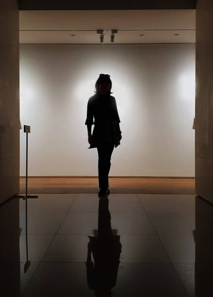 istock A silhouette pose of woman indoor 1307970575