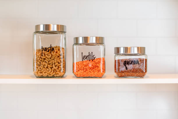 istock Glass canisters lined up on a kitchen shelf 1307970909