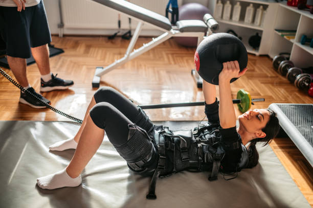istock Woman wearing EMS suit on training 1307971515