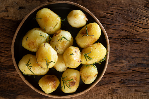 Sarladaise potatoes being cooked in a frying pan
