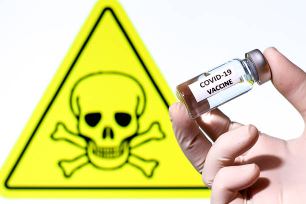 istock Vial filled with liquid on white background with danger symbol 1307973268