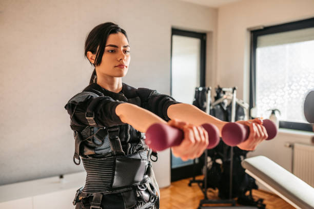 istock Woman wearing EMS suit on training 1307973639