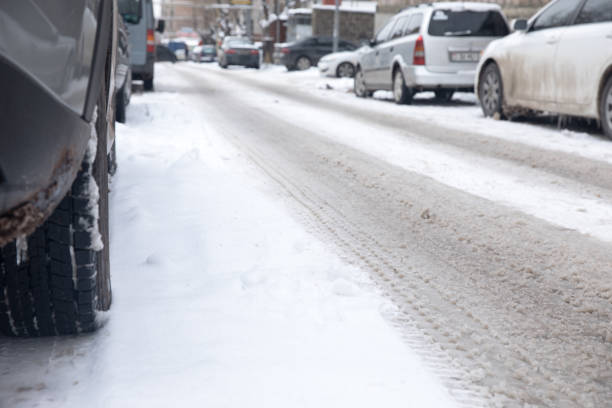 istock Parked cars with snowy road 1307977494