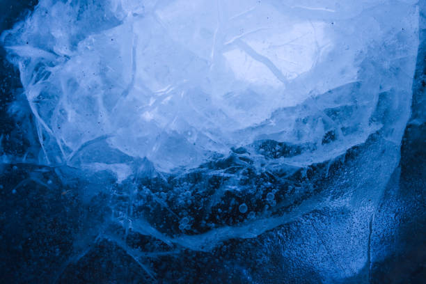 istock Blue cracked surface of the ice, background, texture 1307979887