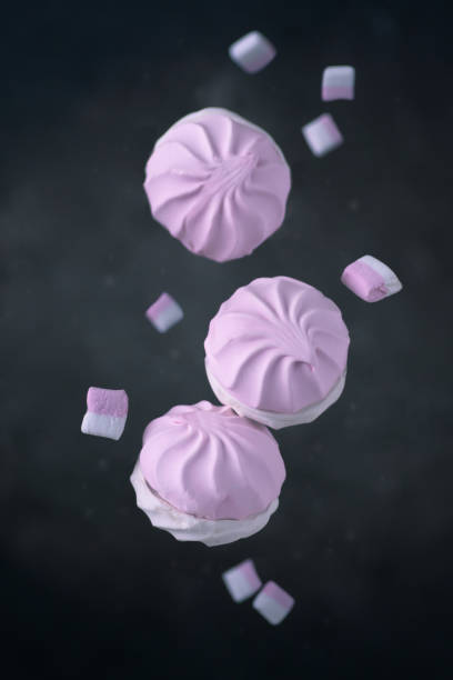 istock Zephyr and marshmallow on dark background, levitation food. 1307983058