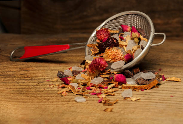 istock Fruit and herbal tea. Tea mixture on a rough wood background. Dried and specially processed plant material. 1307985405