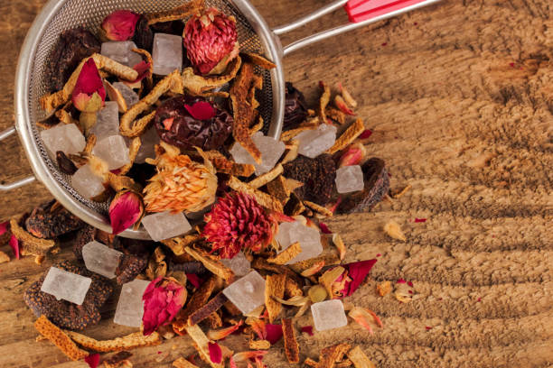 istock Fruit and herbal tea. Tea mixture on a rough wood background. Dried and specially processed plant material. Top view, close-up. 1307985409