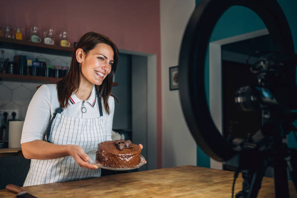 istock Cheerful woman recording vlog about cooking. 1307988727