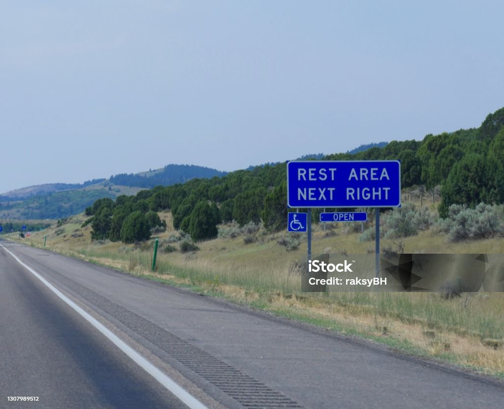 Roadside sign with directions to a rest area along the road in Utah. Rest Area Stock Photo