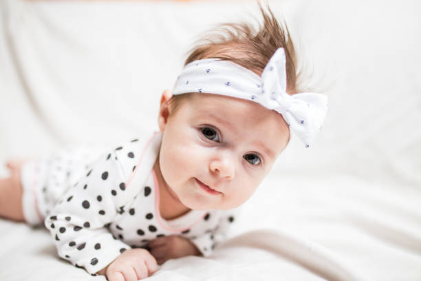 istock Cute baby on bright background 1307991537