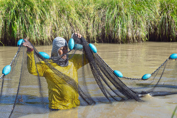 Latino man between 40-45 years old fishing well