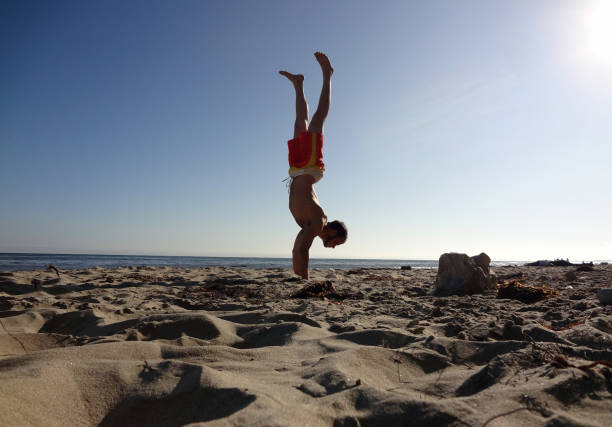 istock Man Handstands on beach in Santa Barbara 1307996478