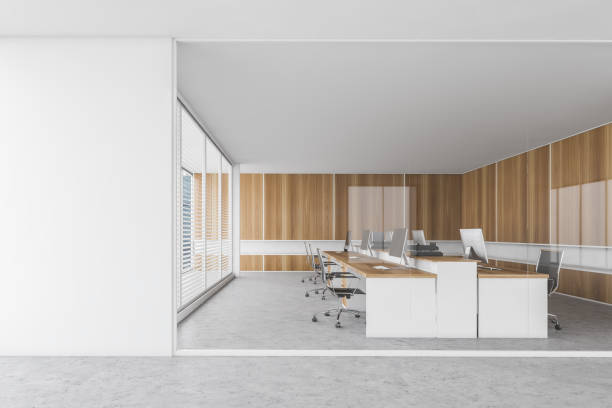 istock Mockup copy space near wooden office room with tables and computers 1307997069