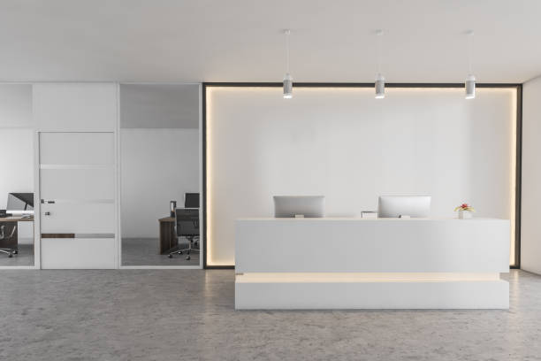 istock White reception room desk with computers, conference office room 1307998106