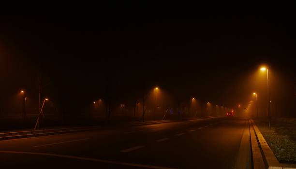 istock Foggy nights street lights 1308002069