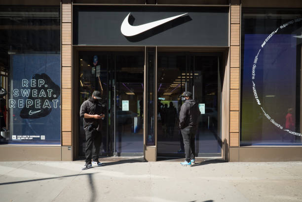 Manhattan, New York, March 11, 2021. Security guards outside a Nike store in Soho.