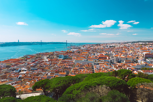 Aerial view of Lisbon city old town and Tagus river. Beautiful Portuguese capital. High quality photo