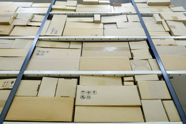 istock Warehouse shelves full of boxes with cargo, loading storage room 1308011269