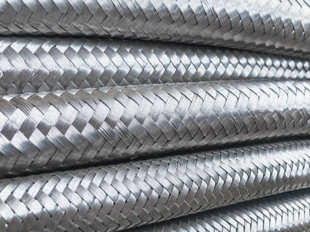 istock Long metal flexible compensator pipes metal texture 1308018671