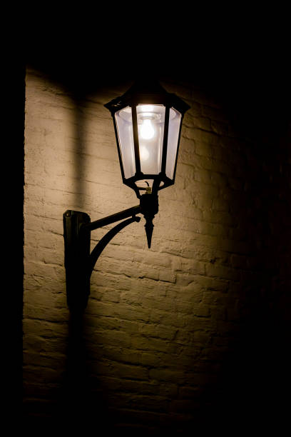 istock old street lamp on wall in Norway 1308018701