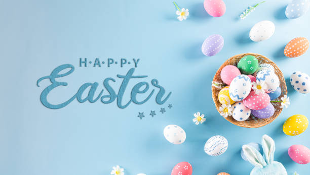 istock Happy easter! Colourful of Easter eggs in the nest with rabbit on pastel blue background. Greetings and presents for Easter Day celebrate time. Flat lay ,top view. 1308020433