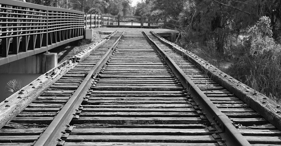 Black and white photo of old train tracks.