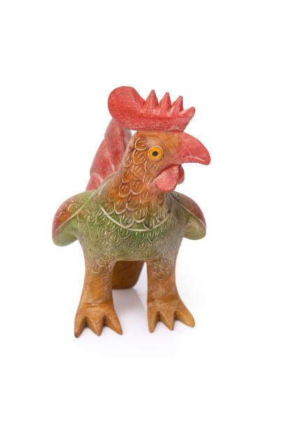 istock Thai handicraft, small chicken carvings  from wood, on white background. 1308025096