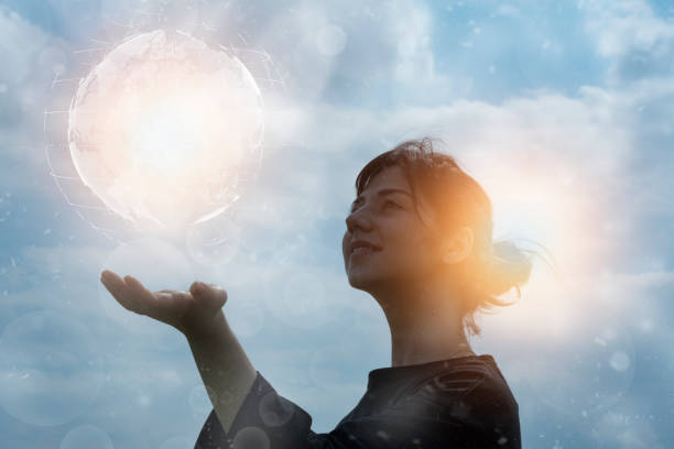 istock a woman trying to touch the earth 1308025306